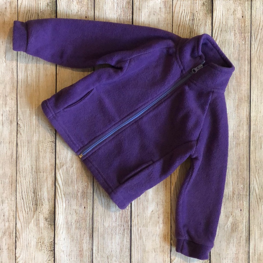 Kids Korner purple sweater jacket.